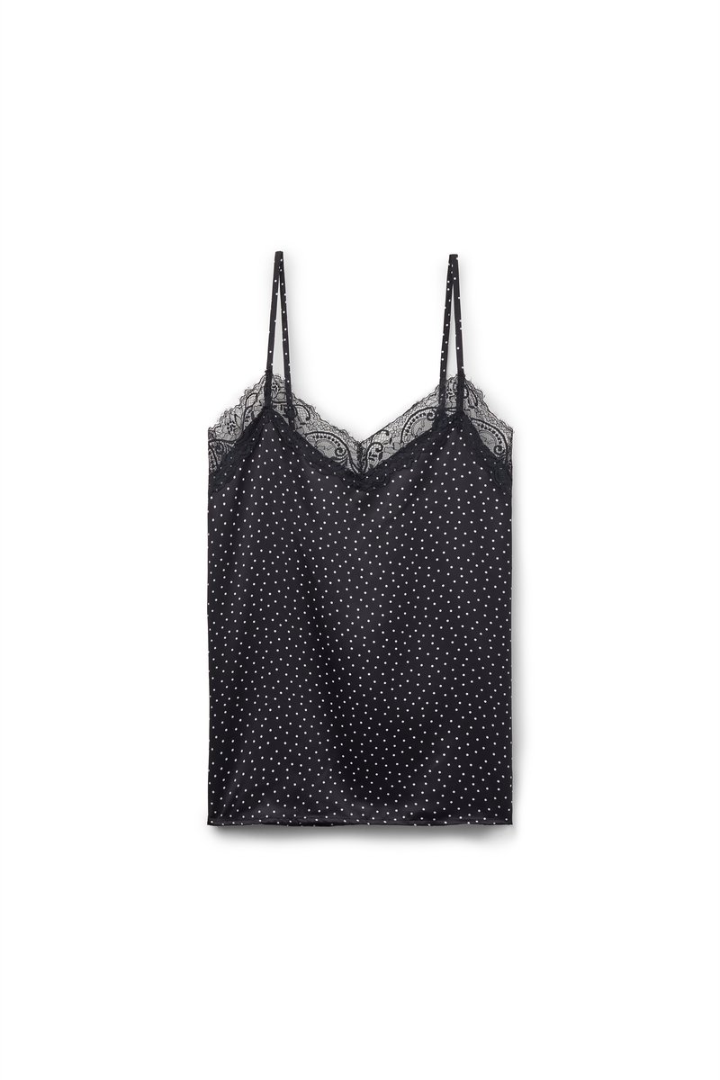 Černá tílko s bílými puntíky, tenkými ramínky a krajkovým lemem kolem výstřihu. Hladká látka s volnějším střihem.