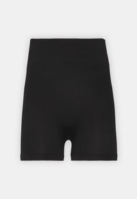 Shorts noirs taille haute en tissu côtelé, présentant une ceinture lisse et un ajustement près du corps, avec des découpes au niveau des jambes.