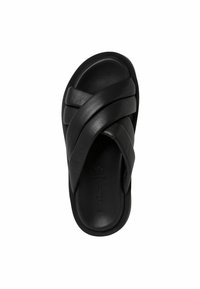 Sandale en cuir noir à glissière avec un design de brides croisées, texture lisse et bout ouvert. La semelle est légèrement arrondie avec un branding subtil.