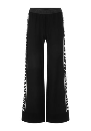 Black wide-leg trousers with an elastic waistband and contrasting white side stripes featuring a pattern. Made of lightweight fabric.