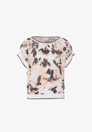 Maglia bianca a maniche corte in maglia con motivo floreale astratto in nero e pesca e scollatura e orlo bordati di scuro.