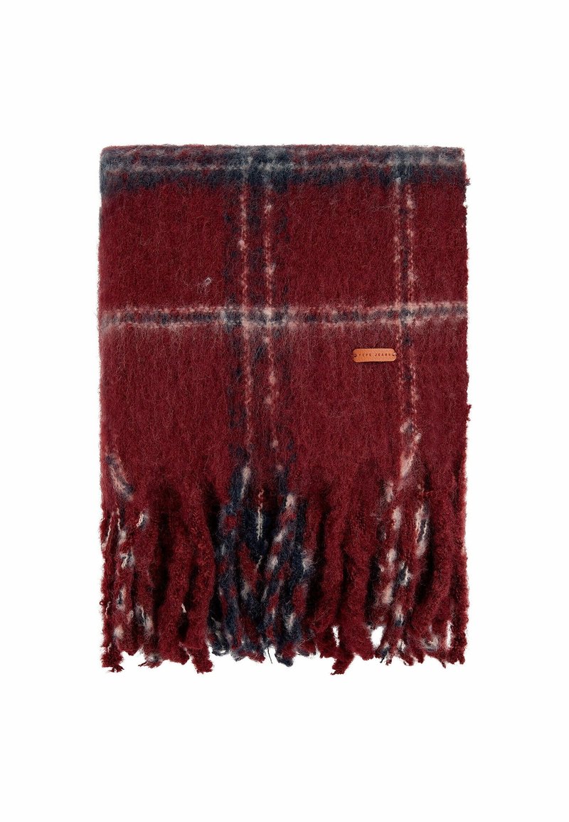 Écharpe douce à carreaux rouges et noirs avec des bords à franges et une petite étiquette rectangulaire marron sur un fond blanc.