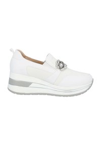 White slip-on sneaker with a textured upper, featuring a decorative embellishment and a wedge sole with a silver accent.