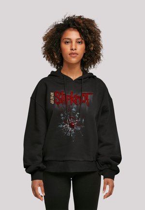 Black hoodie made of soft material, featuring a front graphic with a cracked glass effect and red accents with the text "Slipknot."