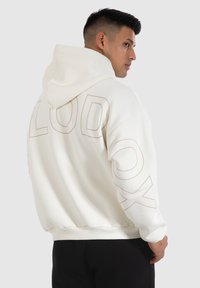 Smilodox HOLLOW BRAIL - Sweat à capuche - creme