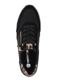 Black sneaker with fabric upper, featuring a textured leopard print accent, gold zipper detail, and black laces. White sole. Brand: Remonte.