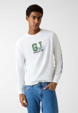 - Bluzka z długim rękawem