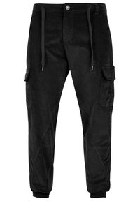 Pantalons cargo noirs en tissu texturé, avec une taille à cordon, deux poches latérales et des poignets fuselés.