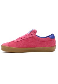Suede sneaker in bright pink with a blue heel collar and purple tongue. Features a gum rubber sole and classic lace-up design.