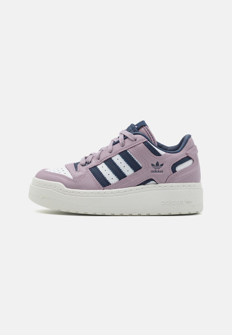Low-platform Adidas sneaker in pink and navy with white stripes, perforated toe, and textured sole on a white background.