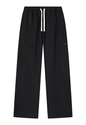 Schwarze, locker sitzende Hose mit elastischem Bund und weißem Kordelzug, ausgestattet mit einer kleinen Seitentasche am rechten Bein.