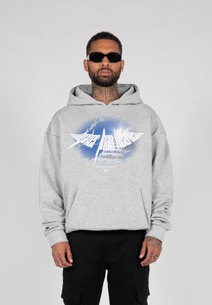 Gray hoodie with a graphic print featuring clouds and text, long sleeves, front pocket, and a relaxed fit. Black cargo pants.
