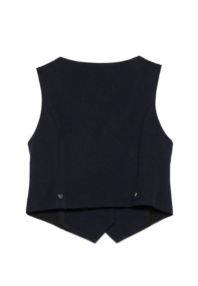 Haut sans manches bleu marine foncé avec un ourlet arrière légèrement évasé, comportant des fentes sur les côtés et de petits accents en forme de cœur près de l'ourlet.