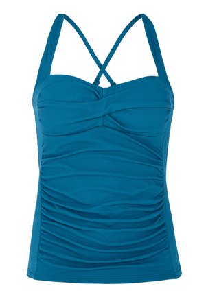 Juslinis mėlynas tank topas su plonais kryžminiais petnešomis, tekstūruota medžiaga ir surišimo detalėmis priekyje, sukurtas prigludusiam įvaizdžiui.