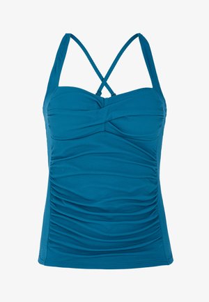 Juslinis mėlynas tank topas su plonais kryžminiais petnešomis, tekstūruota medžiaga ir surišimo detalėmis priekyje, sukurtas prigludusiam įvaizdžiui.