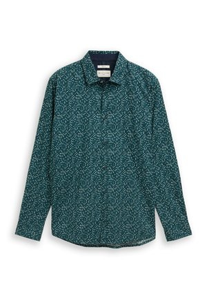 Donkergroen overhemd met lange mouwen, knopen aan de voorkant, kleine witte abstracte bloemenpatronen, wijde kraag en zichtbaar merklabel aan de binnenkant van de kraag.
