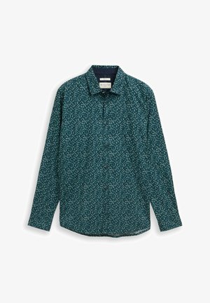 Camicia verde scuro a manica lunga con bottoni, piccoli motivi floreali astratti bianchi, collo allargato e etichetta del marchio visibile all'interno del collo.