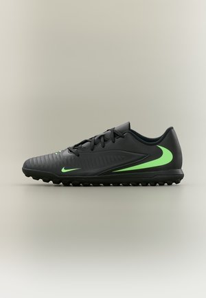 Chaussure de football noire à coupe basse avec logos Nike Swoosh verts sur le côté et la semelle, avec avant-pied texturé et crampons en caoutchouc sur la semelle extérieure.