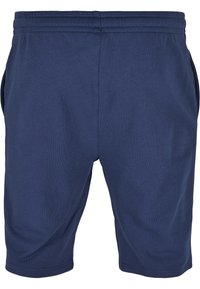Shorts de sport bleu marine en mélange de coton doux, avec une taille élastique et deux poches latérales. Texture lisse sans motifs.
