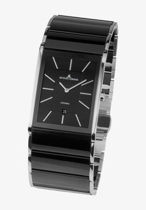 Black ceramic rectangular watch with silver accents, featuring a minimalist face, hour markers, and a date display at the bottom.