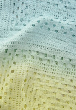 Kootud pleed, millel on gradient alates mündirohelisest kuni heleda kollaseni. Tekstuurilised mustrid avatud ruutudega ja kindlate sektsioonidega.