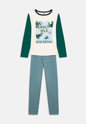 Langärmliges Kinder-Pyjama-Set mit cremefarbenem Oberteil, grünen Ärmeln und Krokodil-Grafik, kombiniert mit türkisfarbenen Hosen.