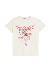 Camiseta de algodón color crema con un estampado gráfico de una bailarina y texto en rosa, con mangas cortas y cuello redondo.