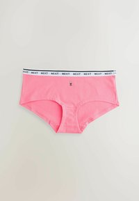 Pink cotton hipster underwear with a white elastic waistband featuring black text reading "NEXT" and a small decorative detail on the front.