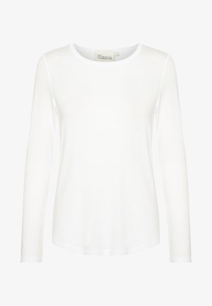 Top blanco de manga larga con cuello redondo. Hecho de una tela suave con un corte ajustado. Etiqueta visible en el cuello. Sin patrones ni acentos.