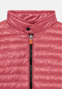 Padded pink vest with a high collar, featuring a black zipper and an orange accent pull. Textured with horizontal stitching for insulation.