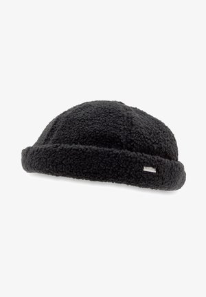 Czarna teksturowana dziana kapelusz bucket z podwiniętym rondem i małą prostokątną metką z logo Kangol z boku.