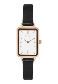 Montre rectangulaire avec un cadran blanc, des accents dorés et un bracelet en cuir noir. Présente des chiffres romains aux positions 12 et 6. Finition de bracelet texturée.