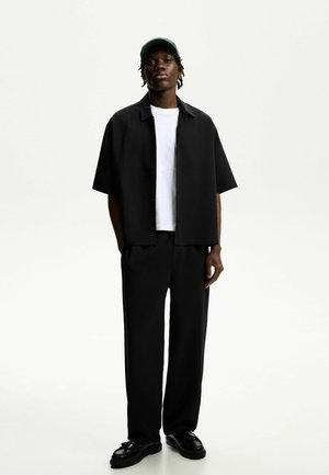 Tracksuit bottoms - black