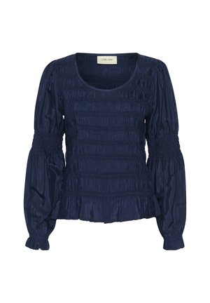 Navyblauwe blouse met elastische smock-details, lange, gepofte mouwen en een ruffle-zoom. Gemaakt van gladde, lichte stof.