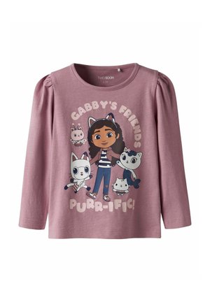 Maglietta a maniche lunghe color malva per ragazze con un'immagine di una ragazza dei cartoni animati che indossa orecchie da gatto e quattro amici animali, con la scritta "Gli amici di Gabby sono purr-ific!"