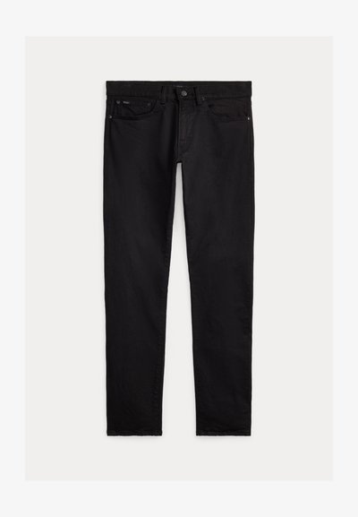 Schwarze Slim-Fit-Jeans mit vorne und hinten Taschen, Knopfverschluss und Gürtelschlaufen, flach auf hellem Hintergrund ausgebreitet.