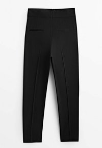 Pantalon noir ajusté longueur cheville avec fermeture éclair au dos et deux poches fendues horizontales, présenté à plat sur fond blanc.