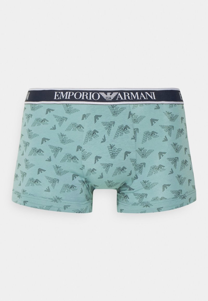 Boxers-briefs pour hommes bleu clair avec un motif répété d'aigle Emporio Armani bleu foncé et une ceinture marine comportant le texte Emporio Armani.