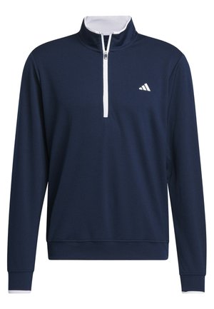 Marinblå tröja med hög krage, vit dragkedja och Adidas-logotyp på vänster bröst. Mjuk tyg med långa ärmar och ribbade ärmslut.