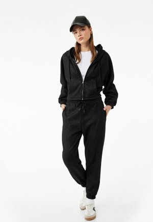 Pantalones deportivos - black