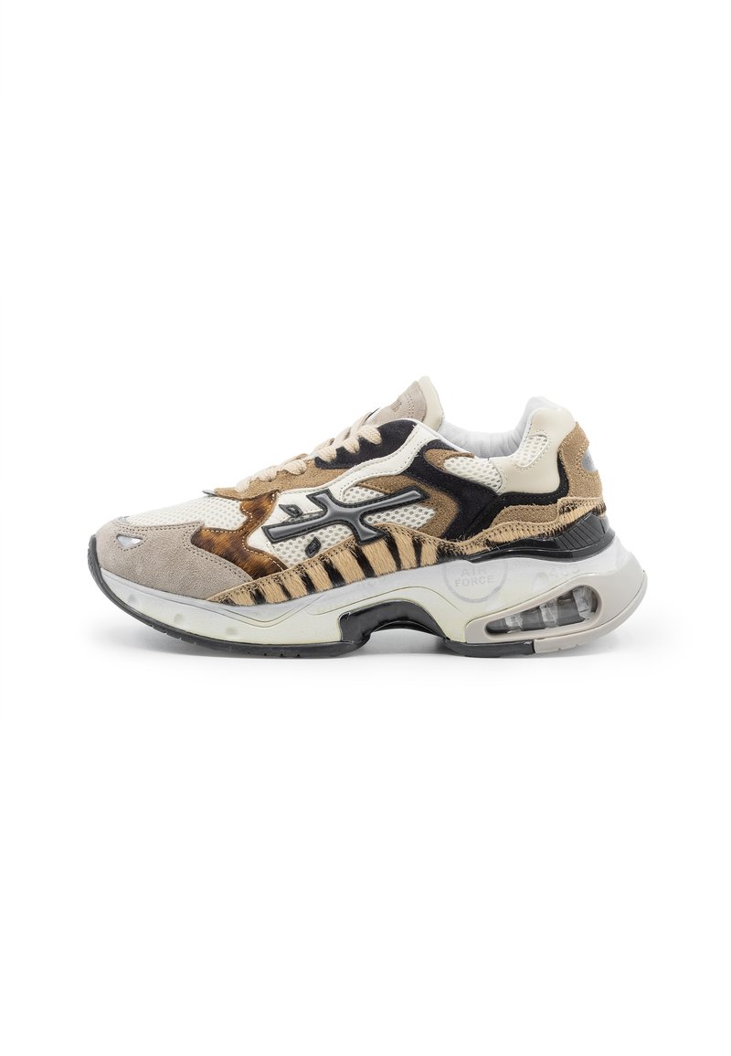 Sneakers featuring a mix of beige, black, and brown materials, prominent mesh details, textured suede accents, and visible air cushioning.