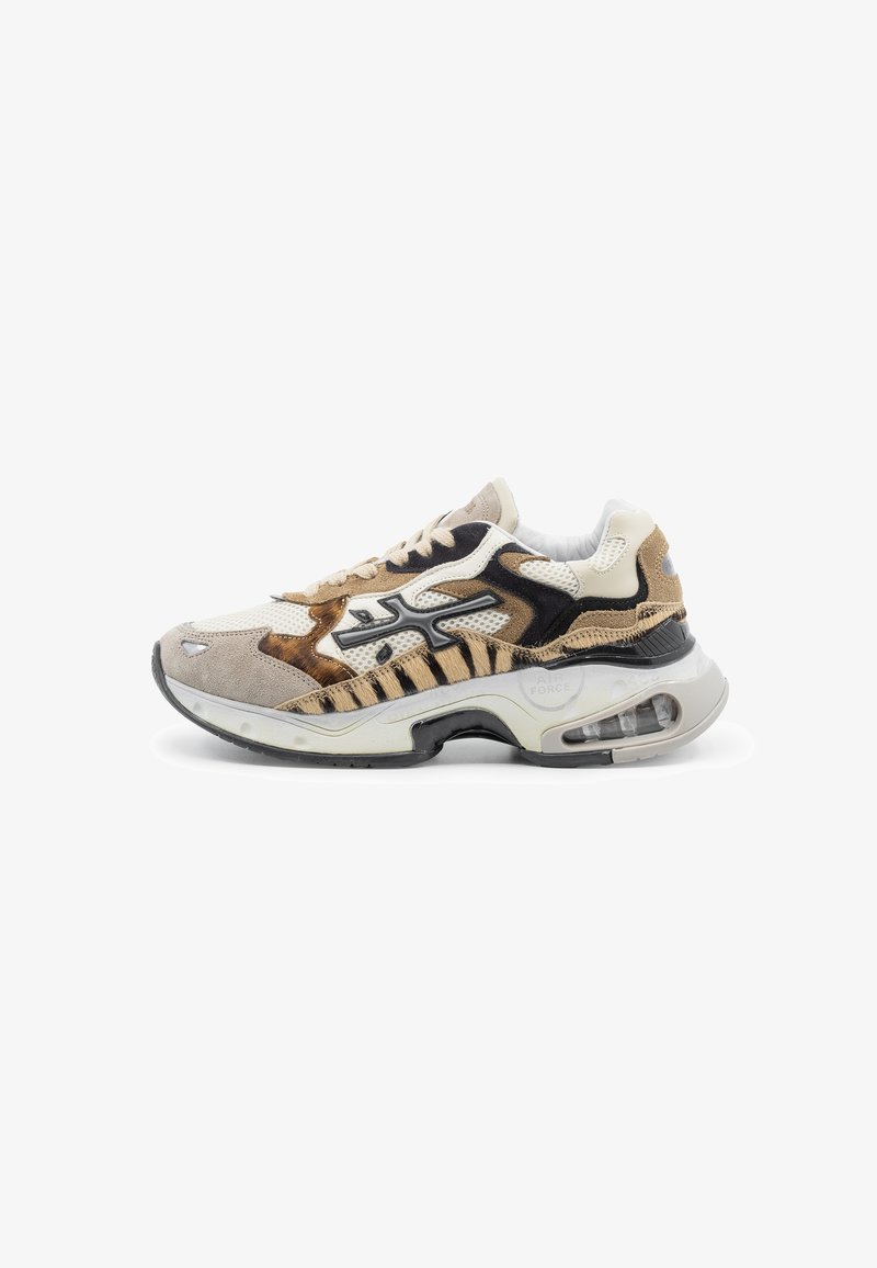 Sneakers featuring a mix of beige, black, and brown materials, prominent mesh details, textured suede accents, and visible air cushioning.