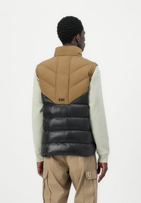 Helly Hansen VILLAGE PUFFY VEST UNISEX - Liemenė - sepia