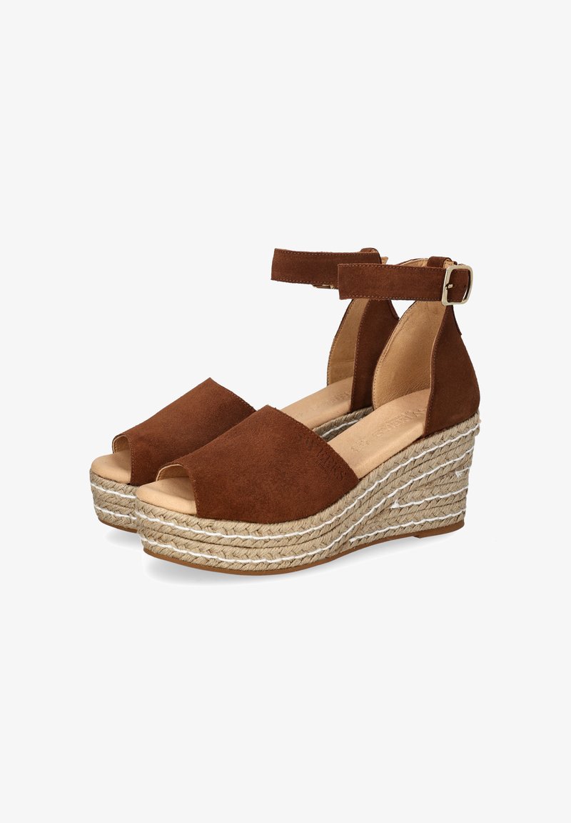 Brown suede wedge sandals with an open toe design, ankle strap, and woven rope platform. Features a textured sole and simple buckle.