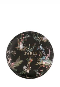 Round black leather pouch featuring vibrant floral and animal patterns. Gold "FABLE" logo at center, intricate stitching around the edge.
