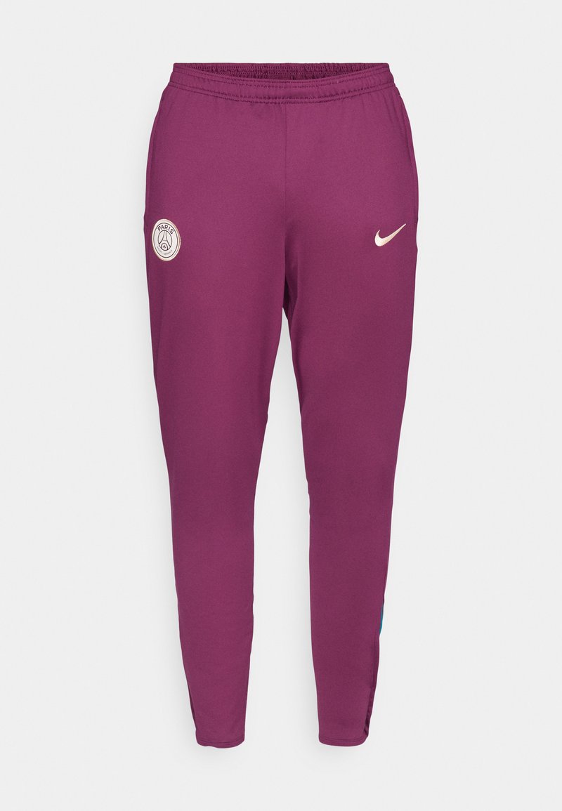 Pantalons de sport violets avec une coupe ajustée, une taille élastique et des accents à bandes sur les côtés. Comprend le logo PSG et le swoosh de Nike en blanc.