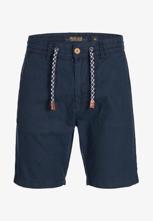 Marineblå shorts med snor i midjen, prydet med flettede hvite og svarte detaljer, lysebrune lærspisser og sømmer. Laget av bomull.