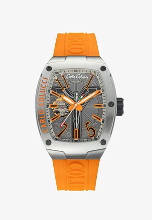 Silver-toned watch with an orange rubber strap. Features a grey dial, bold orange hour markers, and a visible movement through the dial.