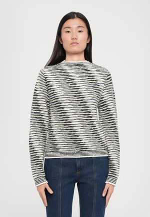 Knitted sweater features a wave pattern in black, white, and yellow. Round neckline, long sleeves, and a fitted shape.