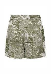 Short ample avec taille élastique et motif de feuilles tropicales vertes sur tissu blanc.